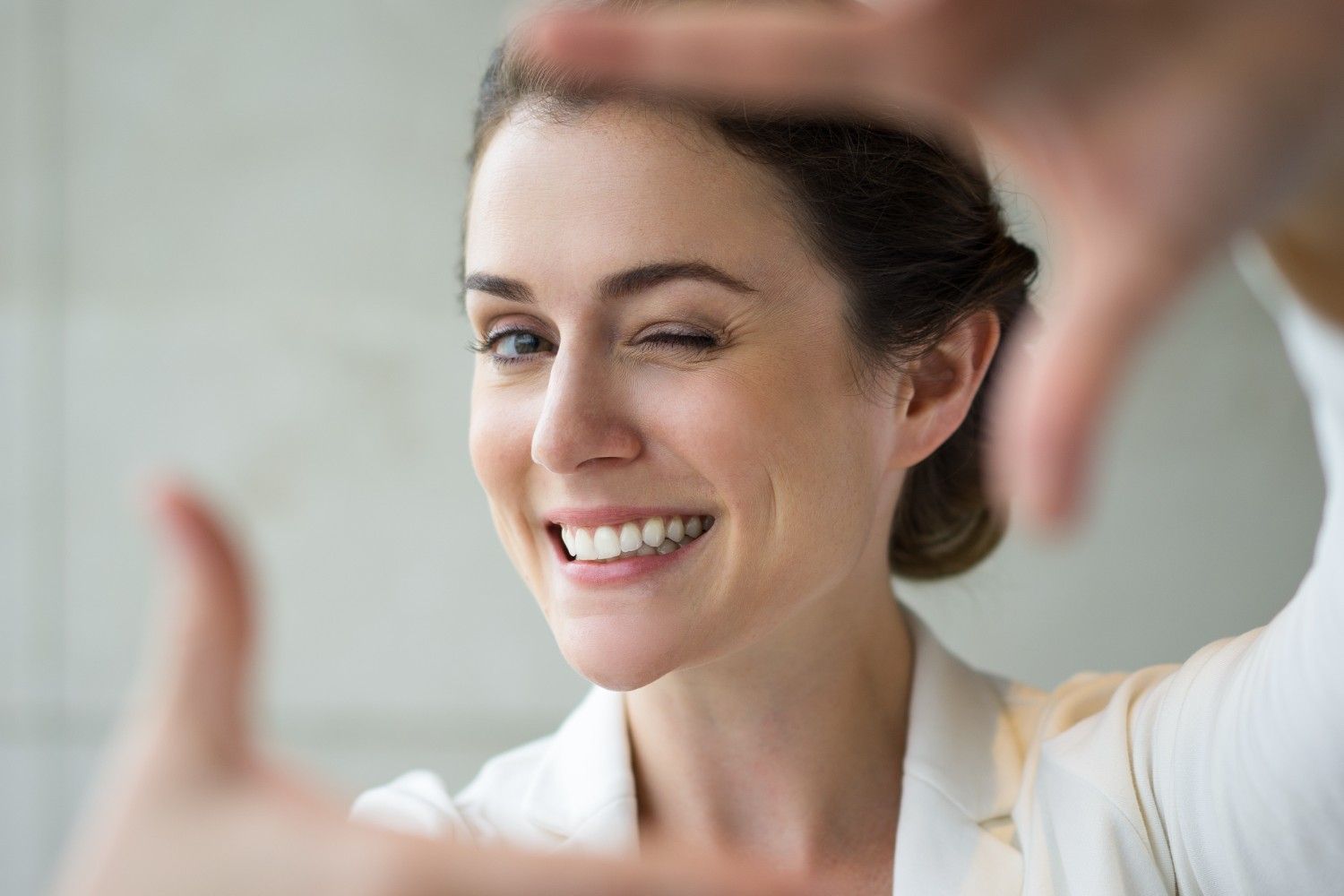 Closeup Smiling Woman Making frame Gesture